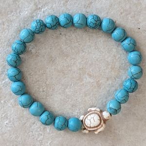 Turquoise bead stretch bracelet with turtle accent